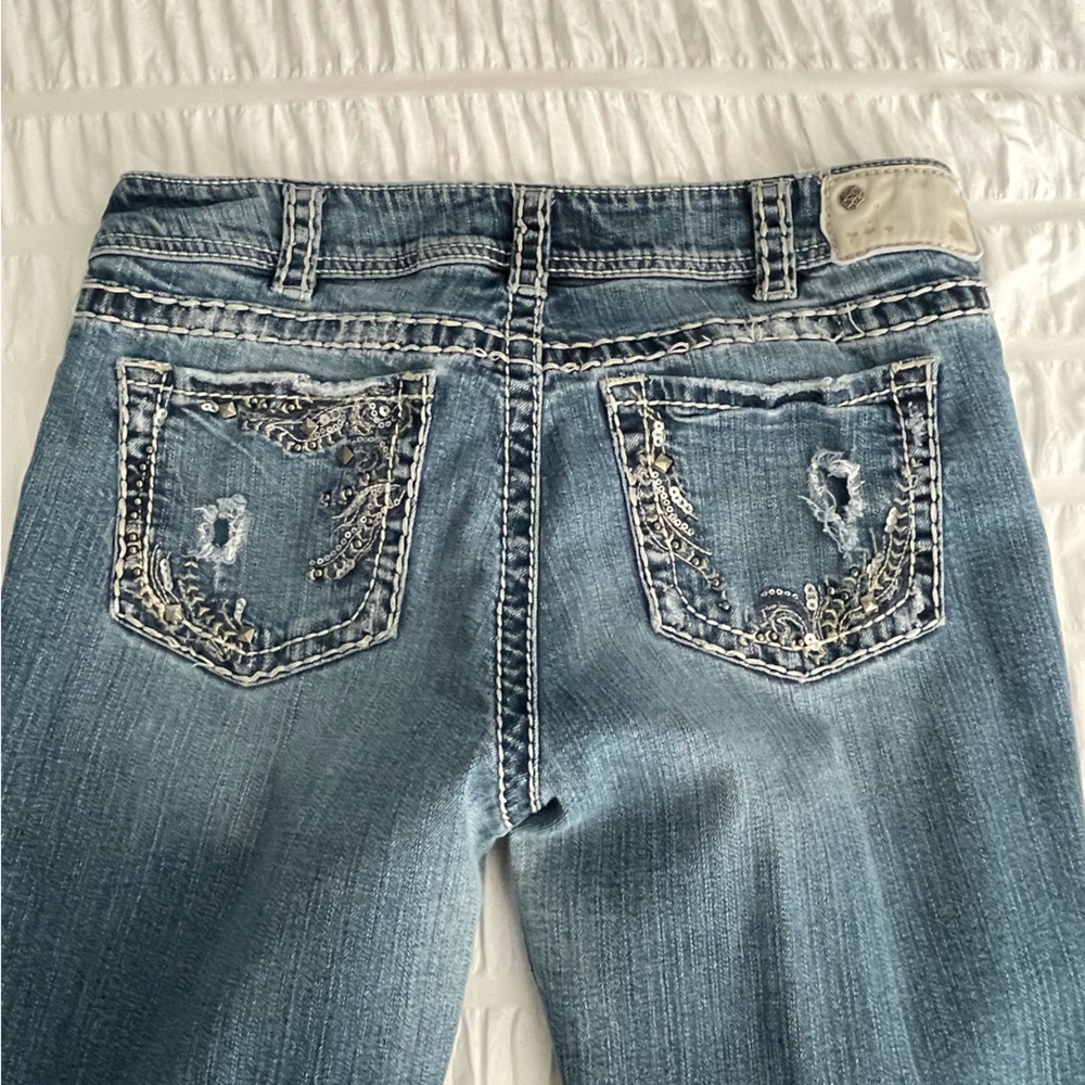 Silver Suki denim boot cut mid rise jeans. Size 32x34